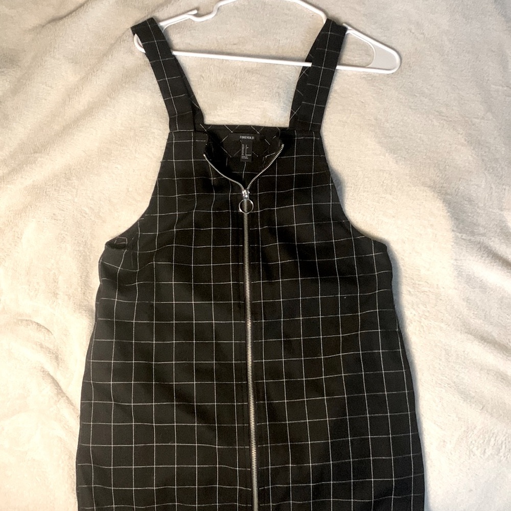 Minnie black checkered dress with a zip up in front , The waist is not cinched